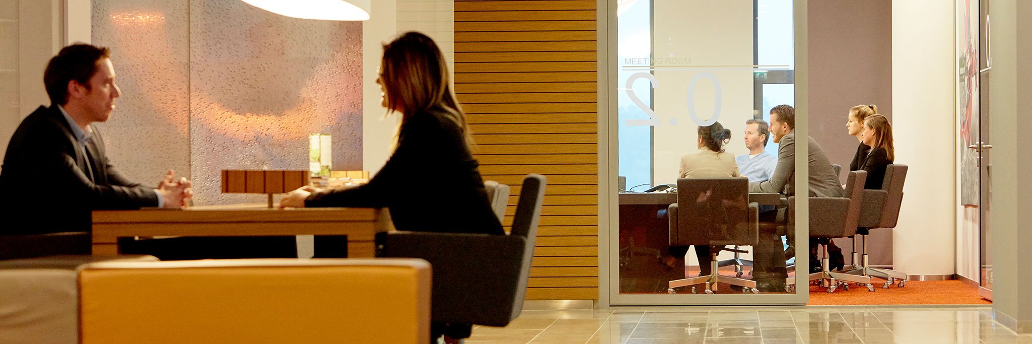 People having meetings in office