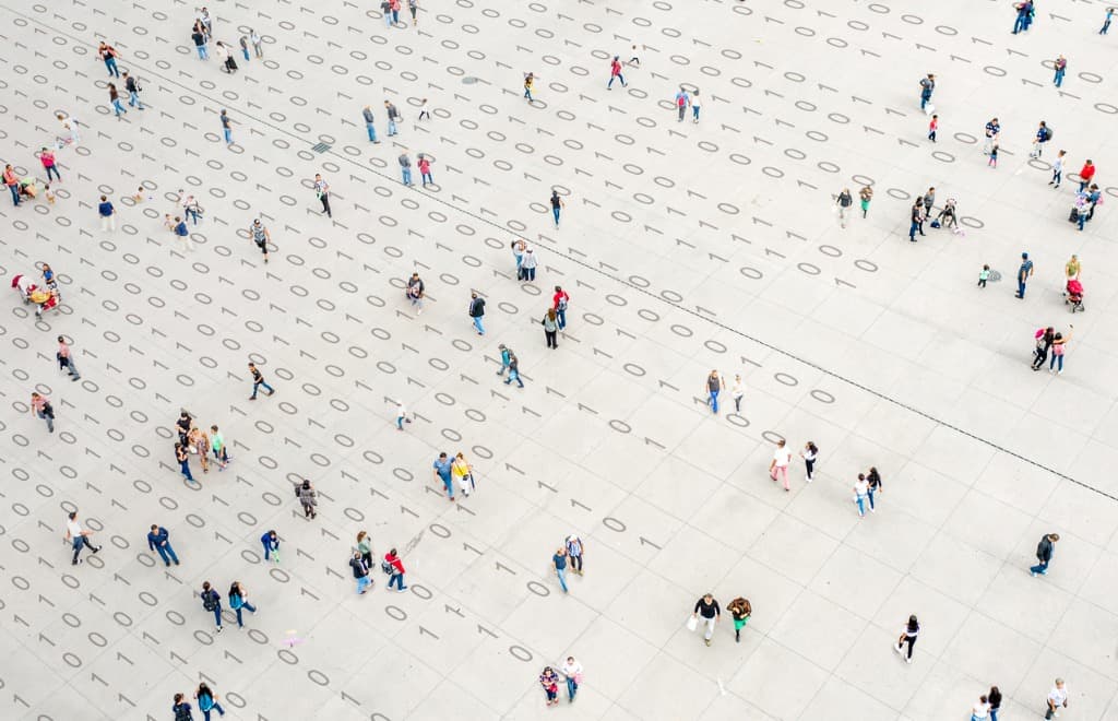 People walking on a square with number on the floor