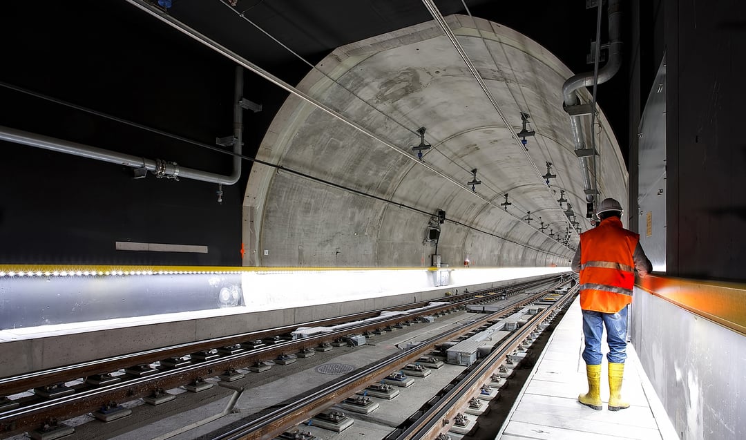 Railway worker in underground railway tunnel