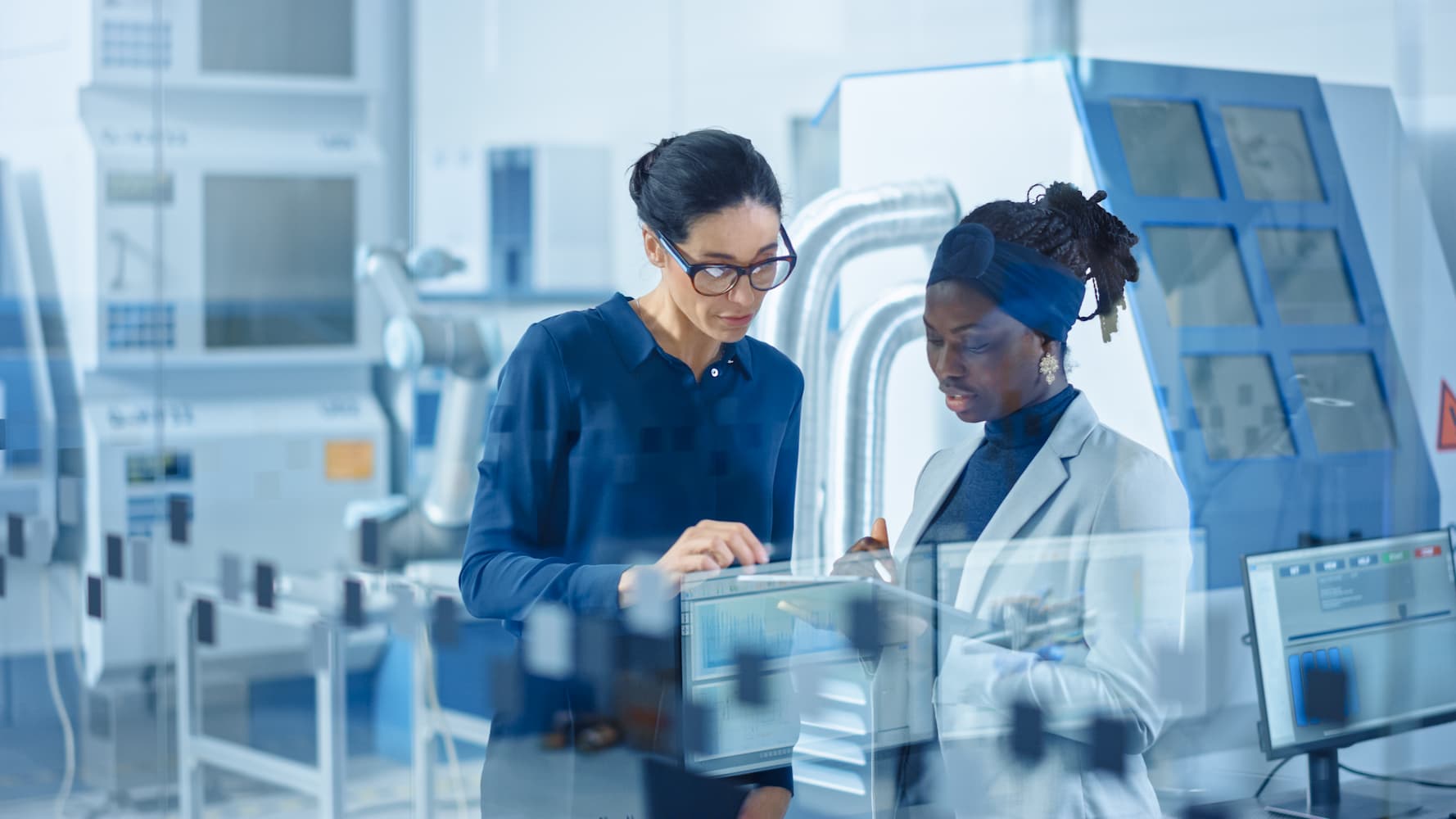 Two women in high tech environment