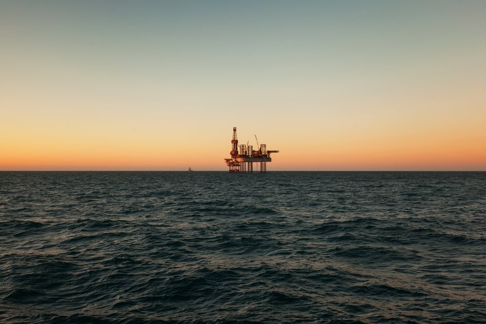 Photograph of an Oil Rig at Dawn