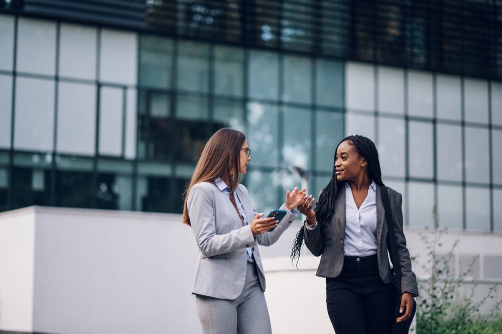 diverse professional women talking