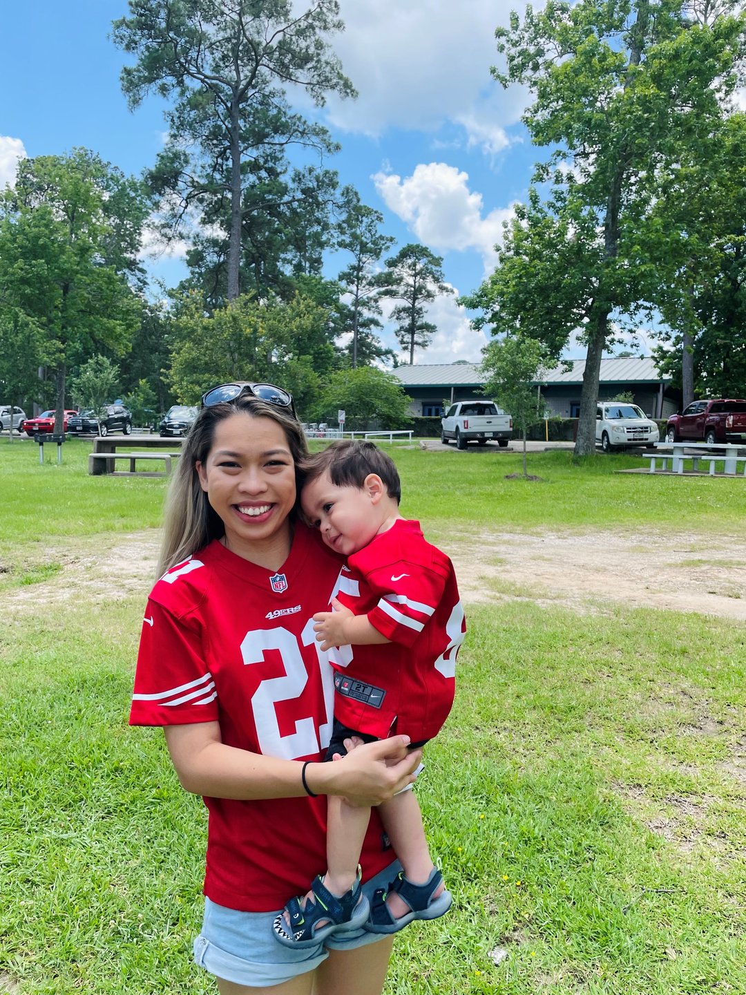 Mother and child in matching 49ers jerseys