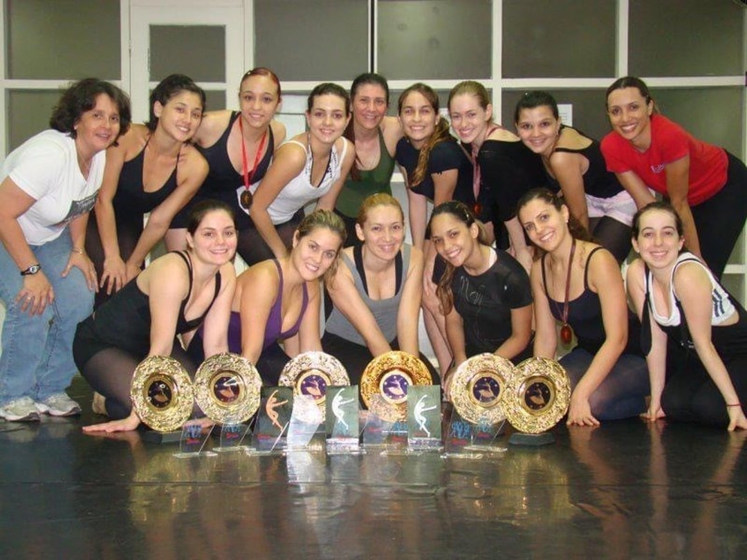 Dance team celebrates numerous trophy wins with group photo