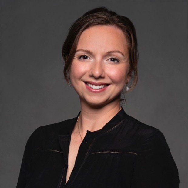 Woman with brown hair in black blouse