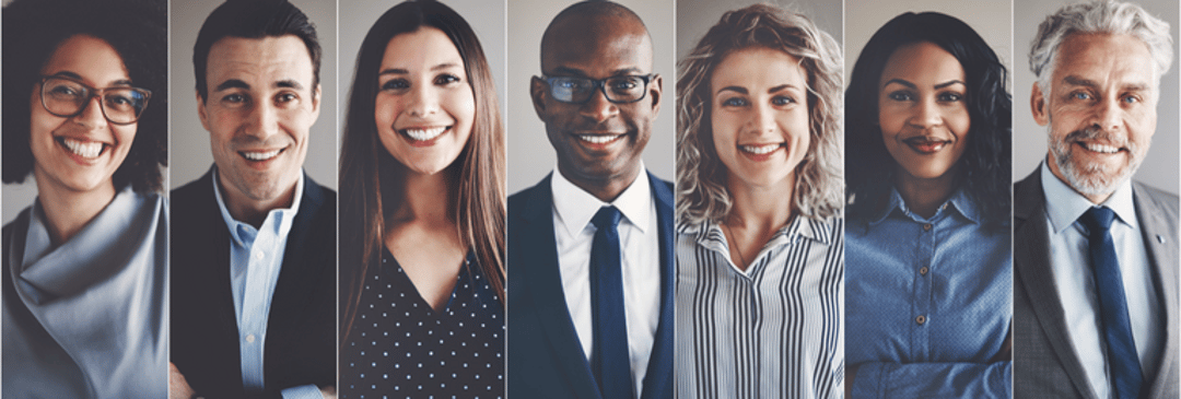 7 headshots of diverse group of people smiling in professional clothing.