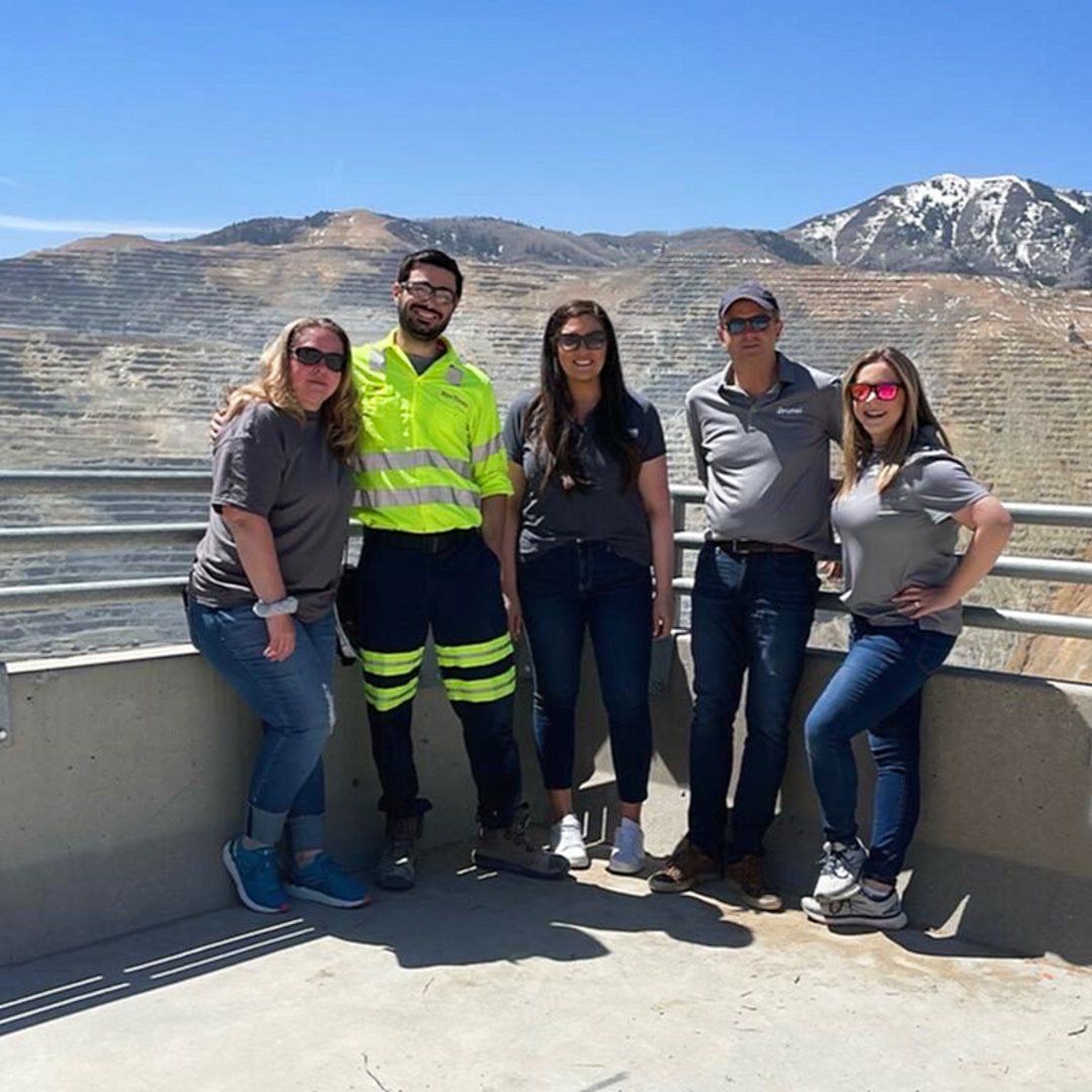 Brunel team members posing with a contractor at Kennecott Mine