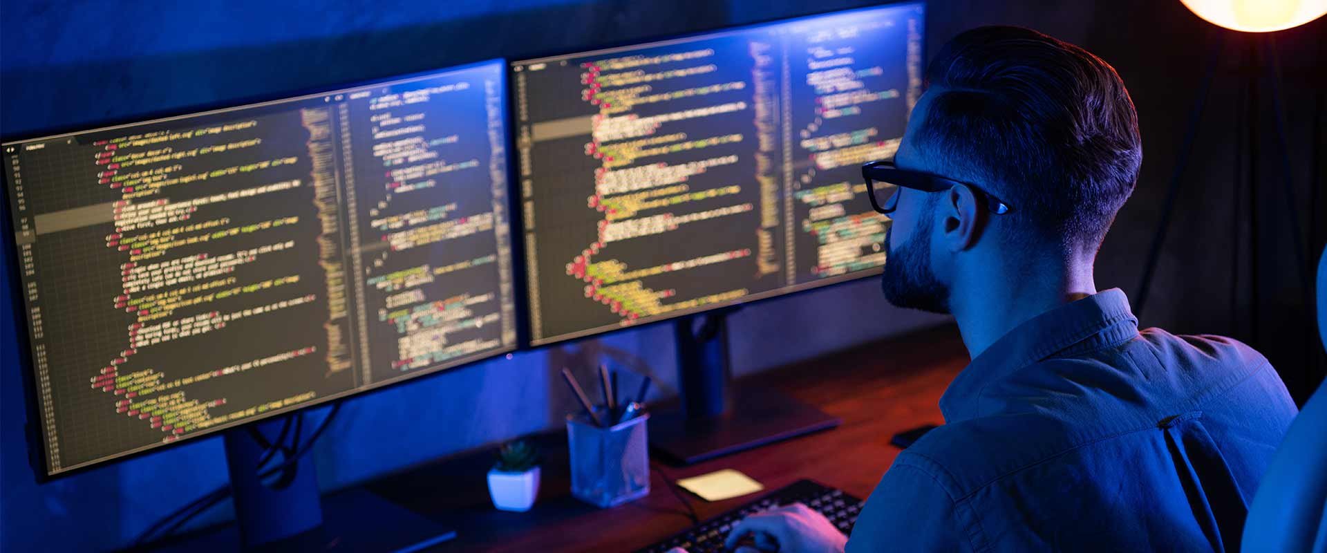 Cybersecurity professional working in office testing systems and network