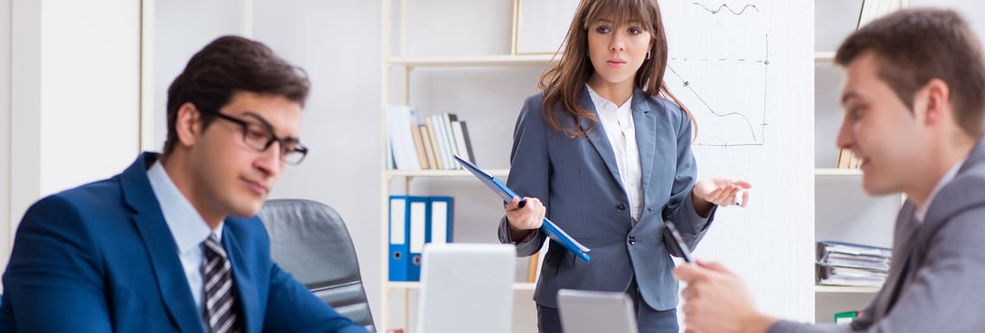 Woman ignored and undervalued during presentation by her colleagues