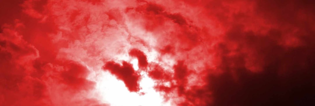 Sky with clouds in red tint 