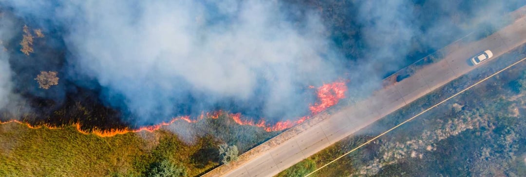 Smoky bushfire next to road on Australian highway