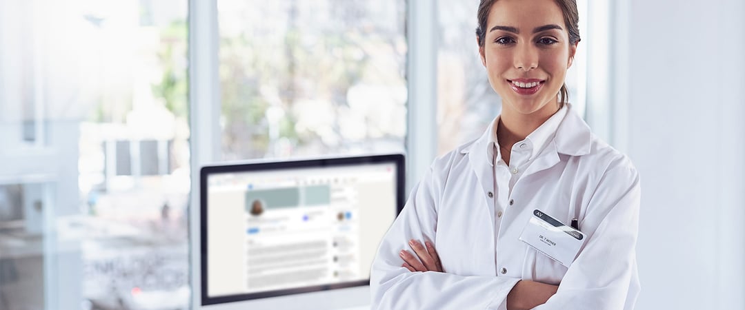 Female scientist updating her LinkedIn profile on computer