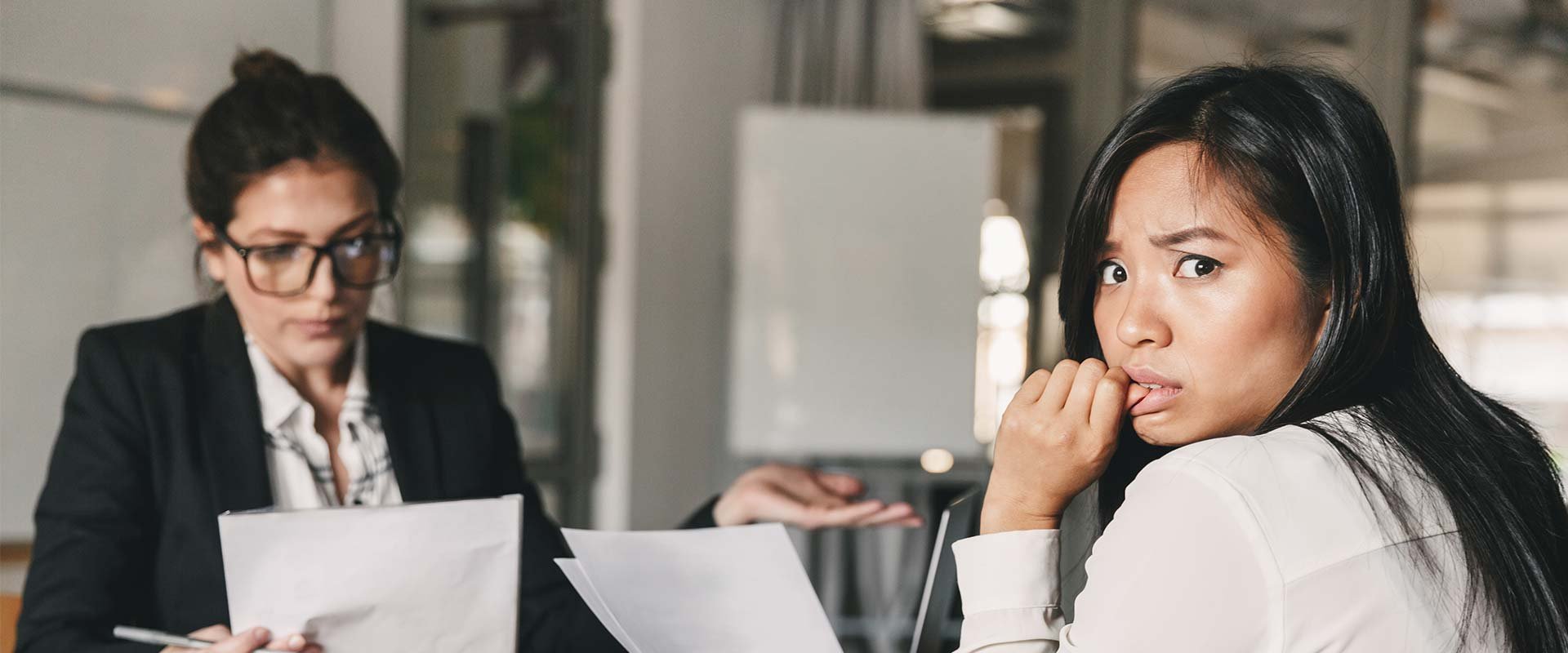 Woman in interview nervous about answers for job