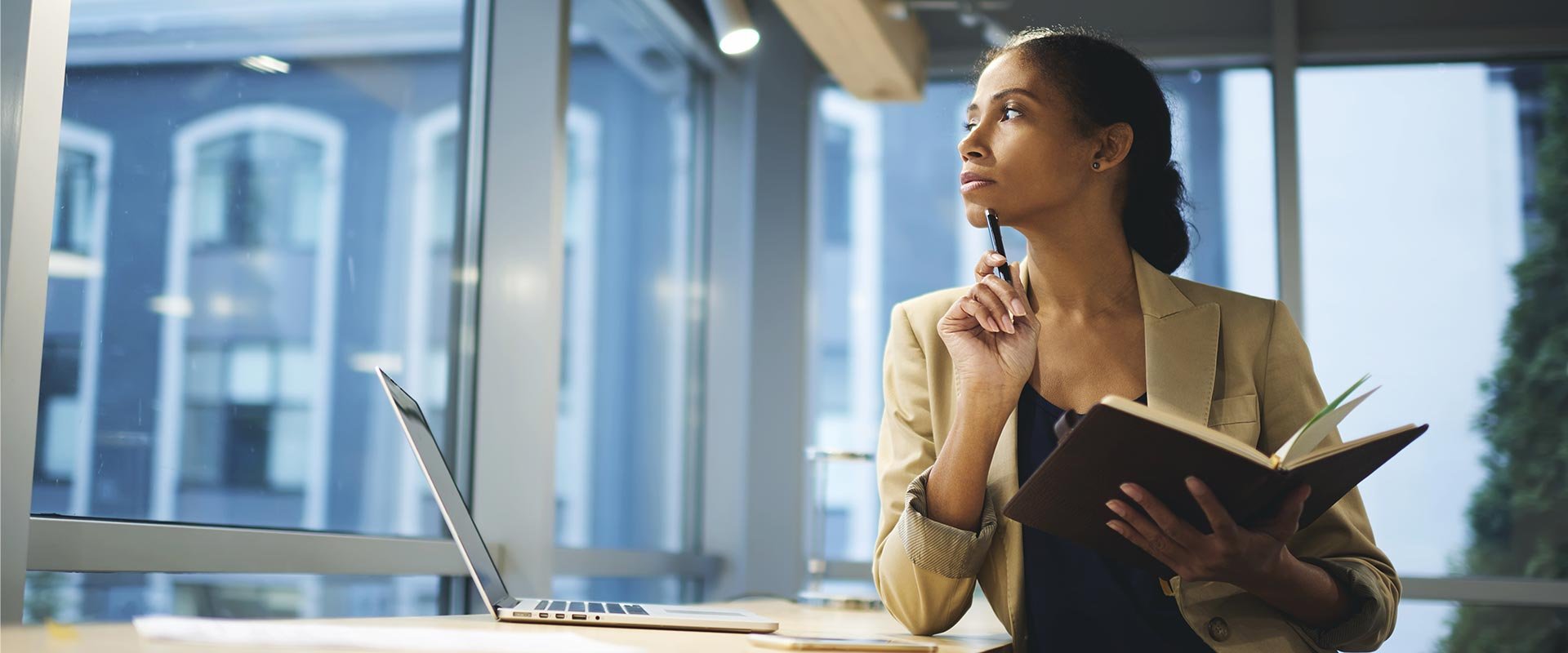Young professional thinking about job offers pros cons