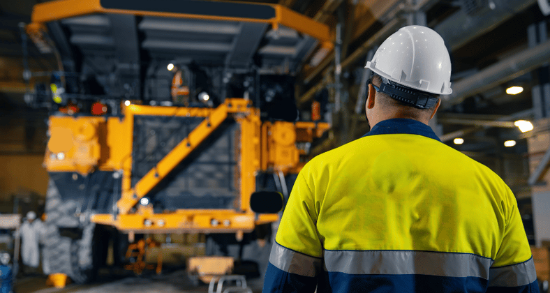 Head engineer reviewing mining equipment