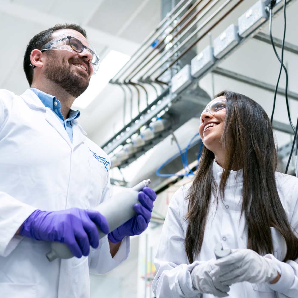 Two scientific staff in medical device manufacturing facility