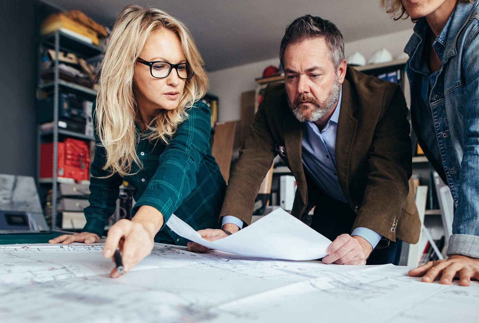 Woman and man checking project plan in office