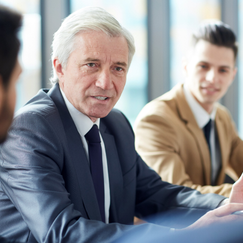 Male executive holding board meeting