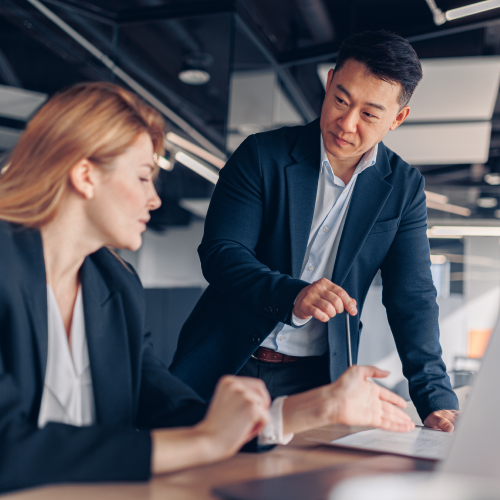CEO speaking with executive in meeting at firm
