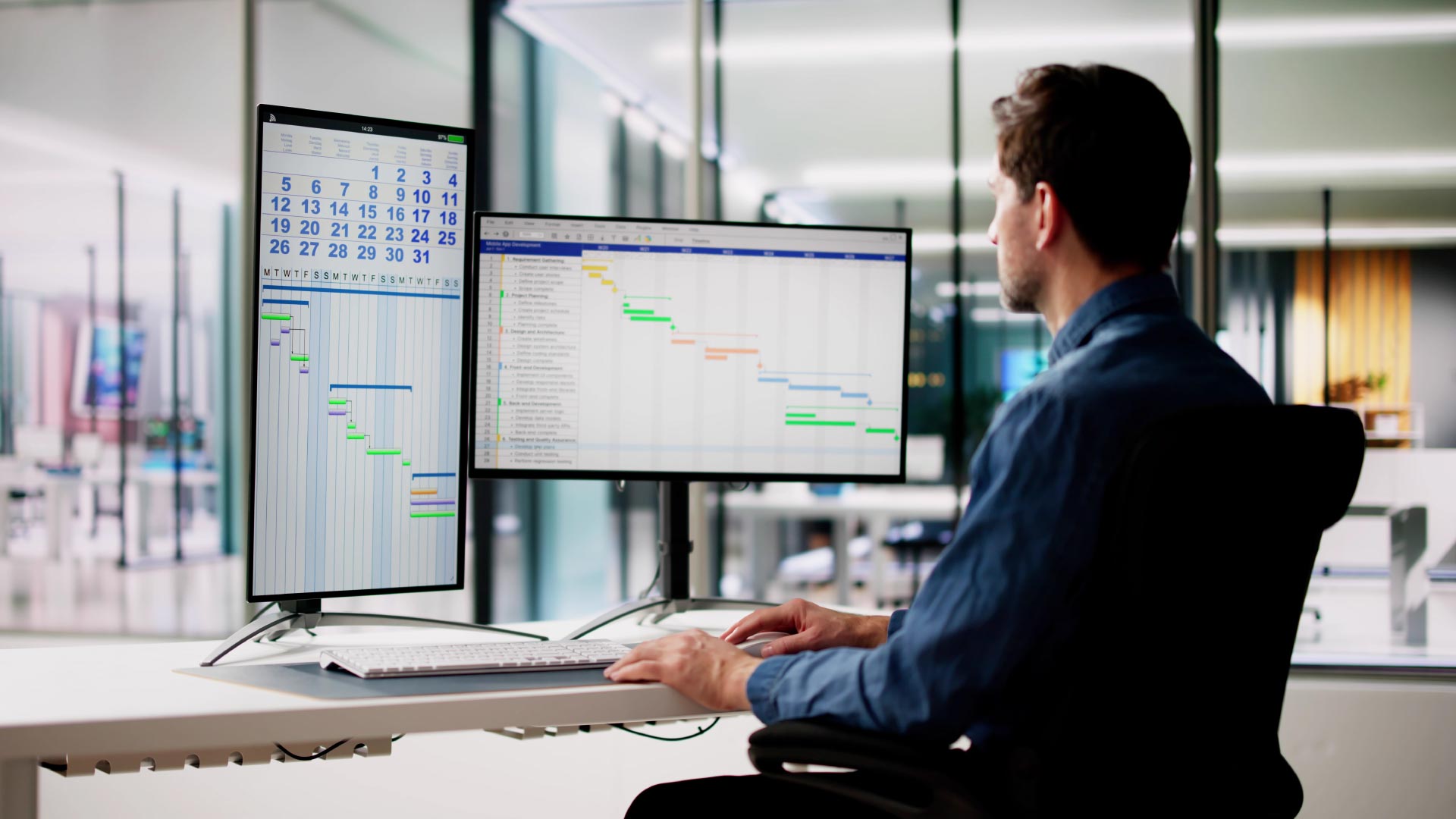male project manager in office gantt chart organising