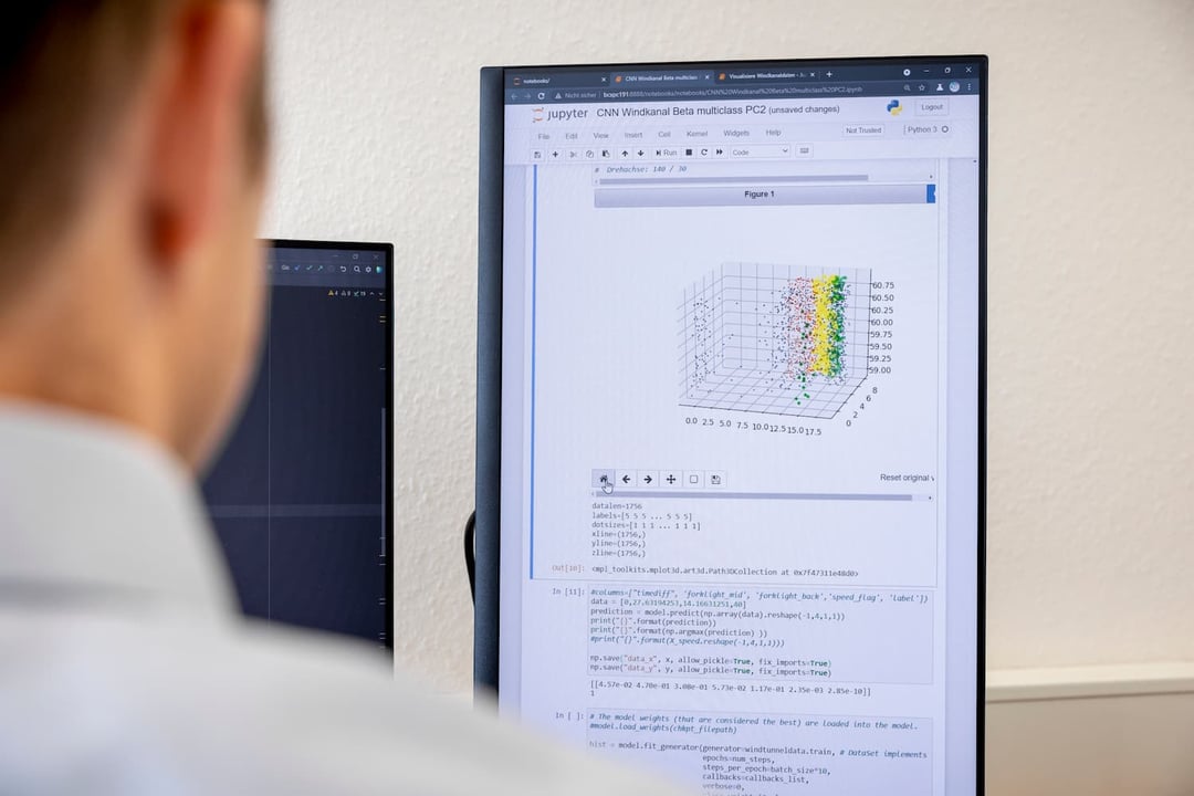 Man looking at screen with data analysis