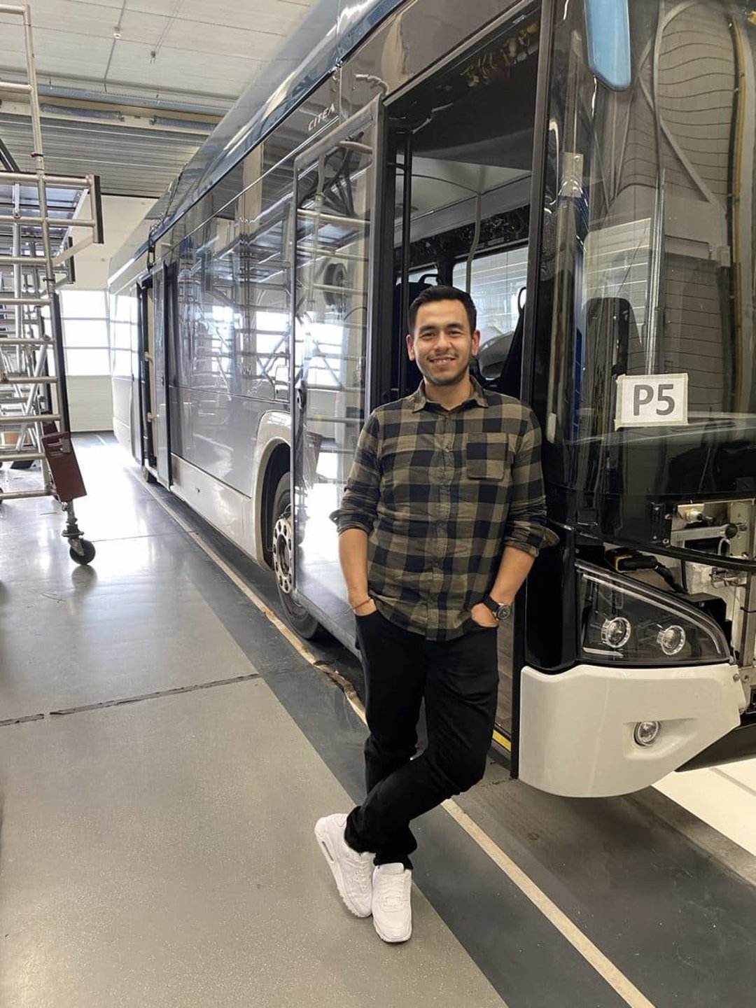 Man in front of bus at VDL factory