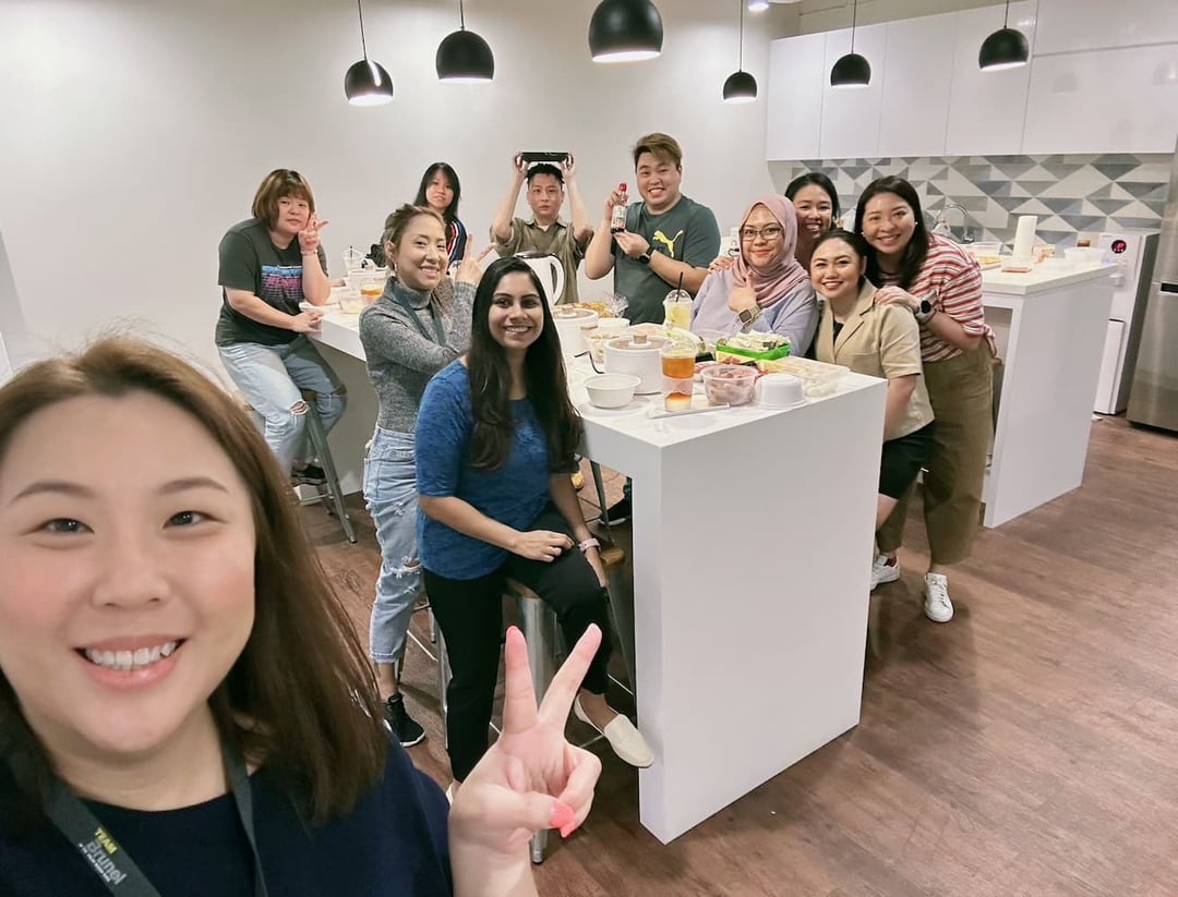 Rachel Go with team in the Singapore office