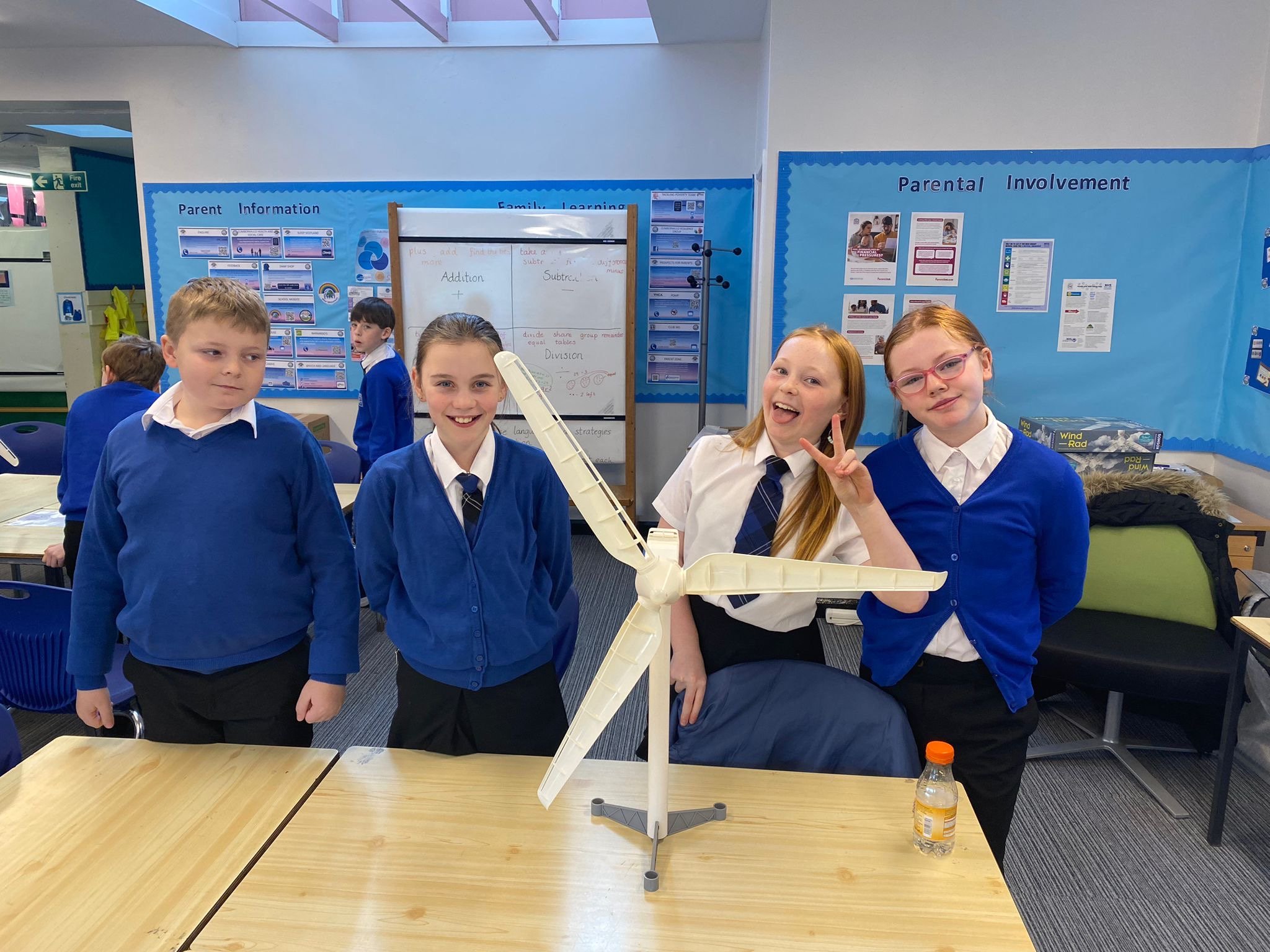 Students in a classroom presenting a wind turbine model during a Brunel Foundation event