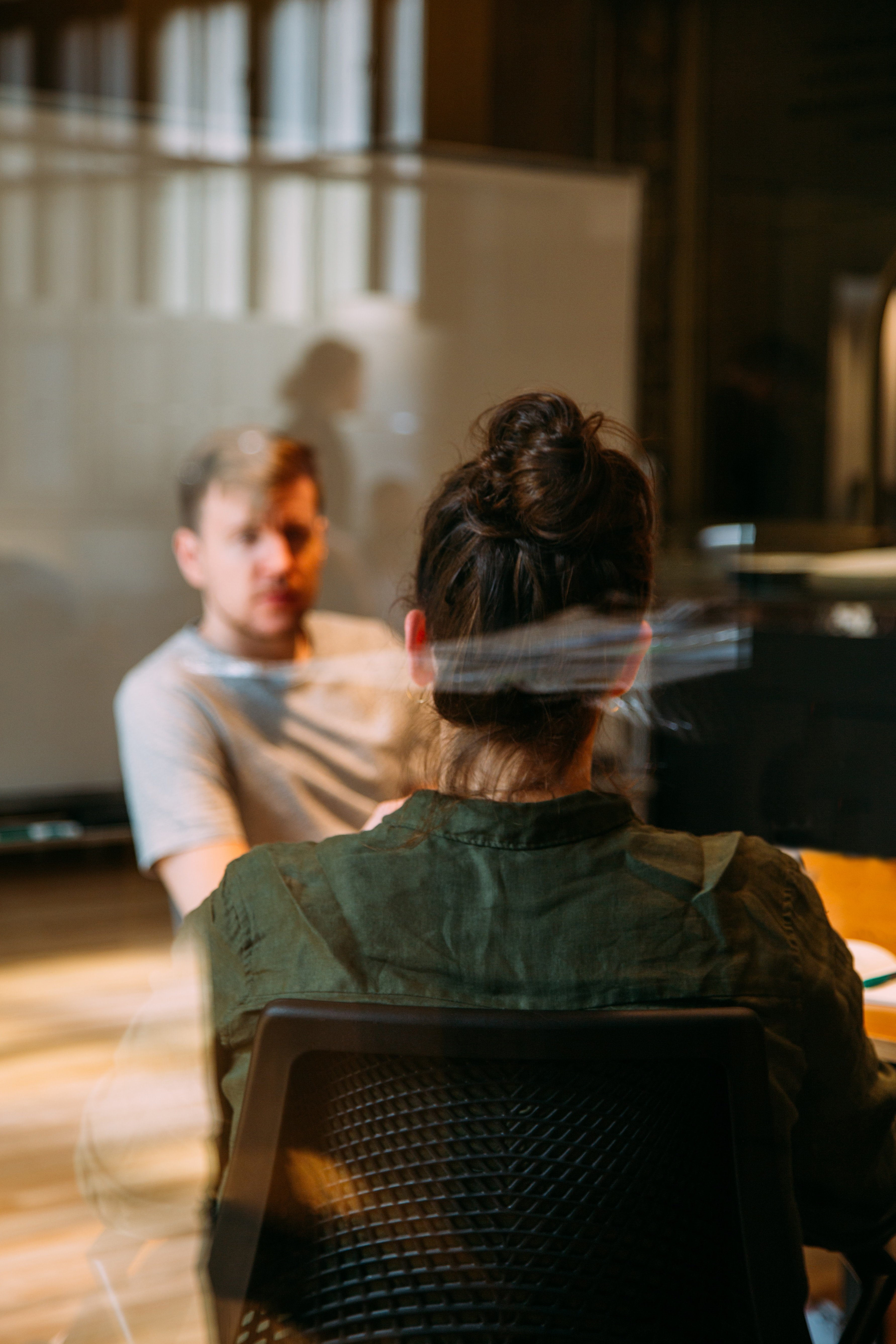 Man and woman sitting across from each other at table