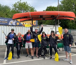 Brunel Employees in Manchester, England gathering to help clean up trash.