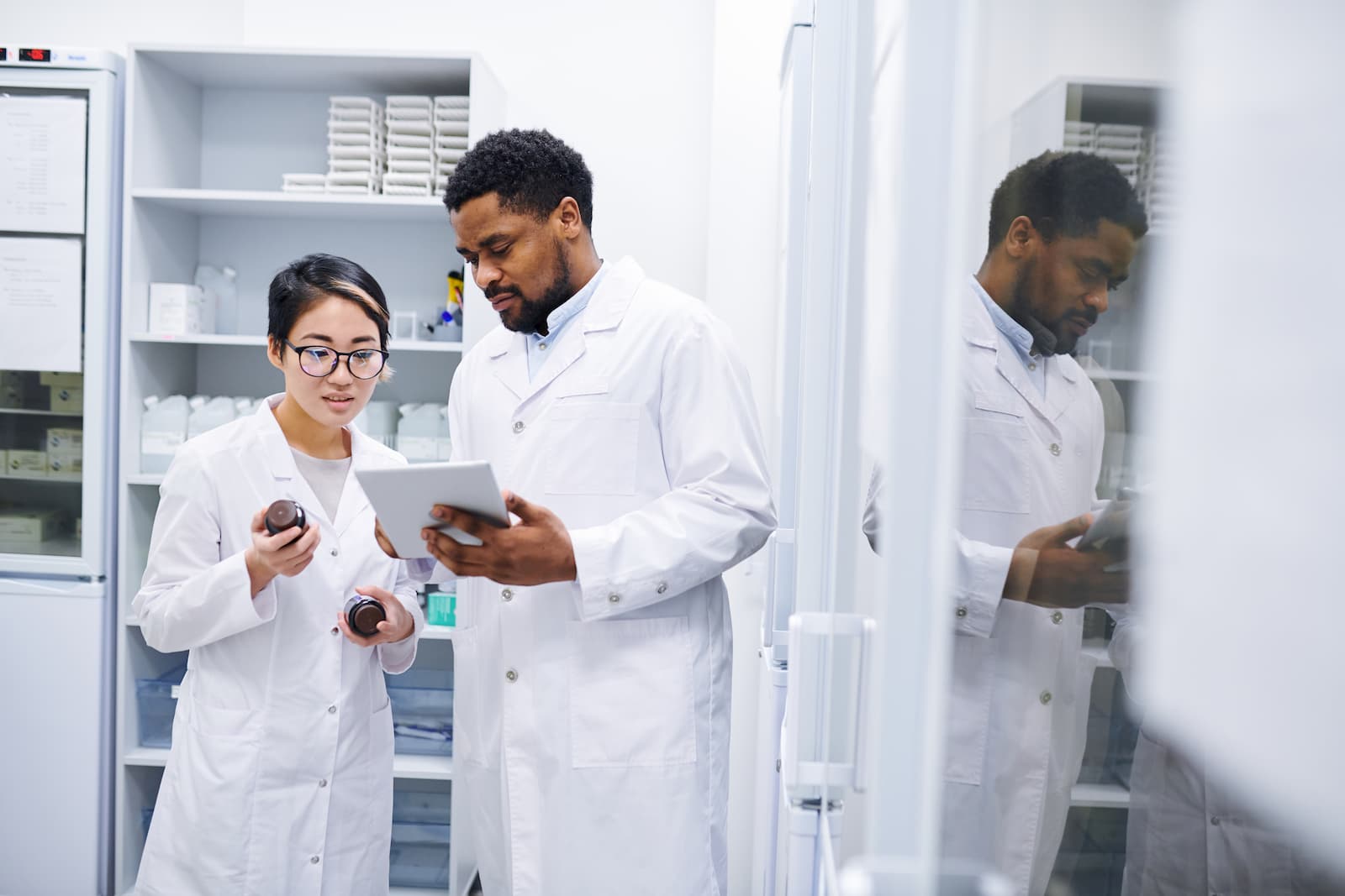 Lab technicians looking at information