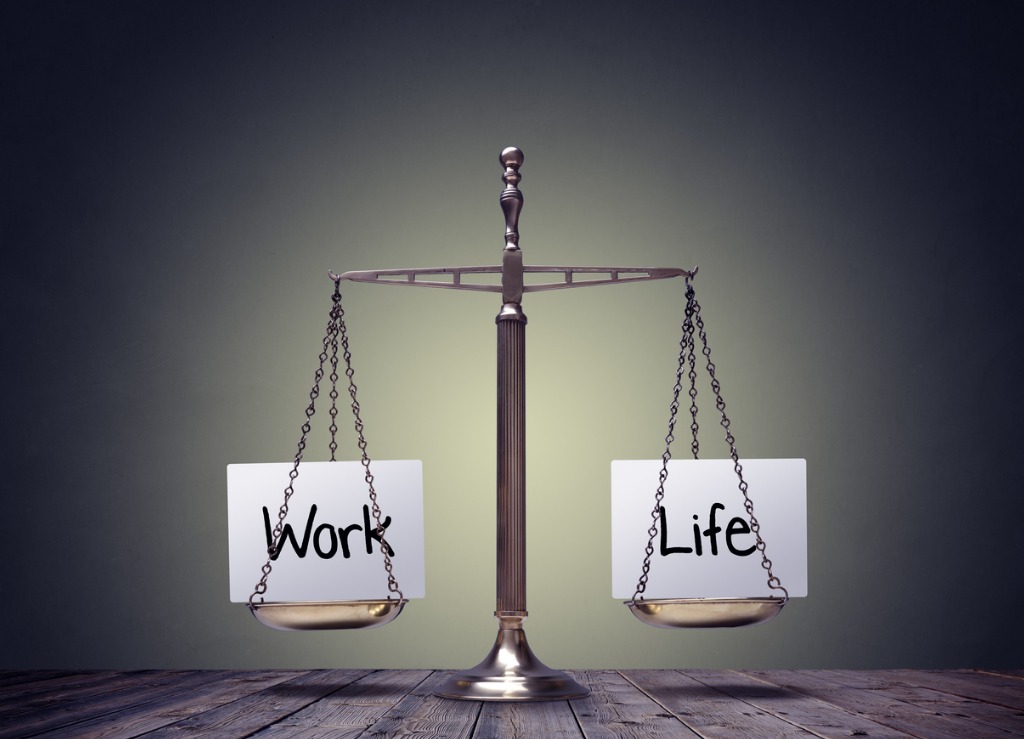 Papers with 'work' and 'life' written on it on a scale