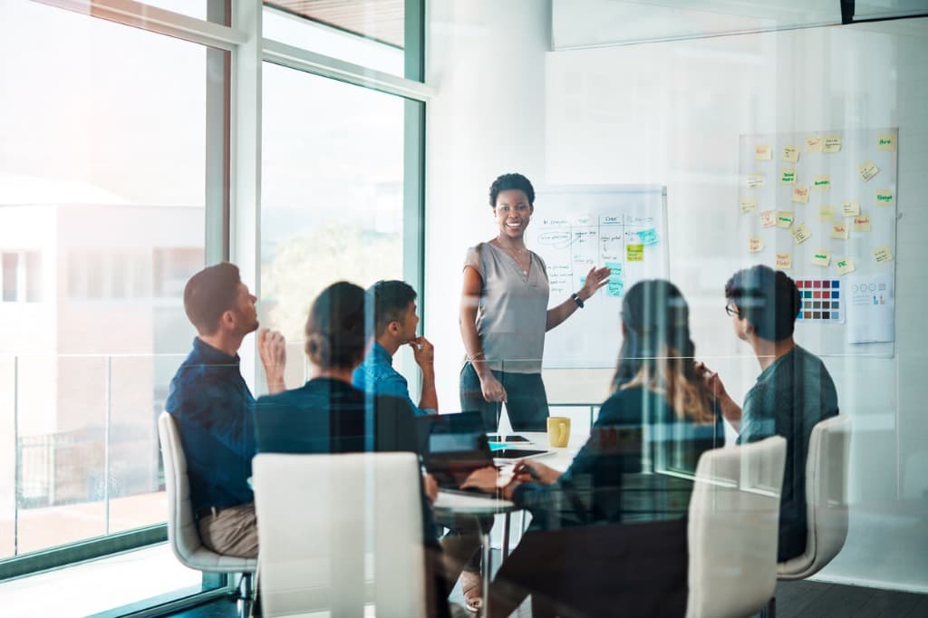 Group of people in a glass office