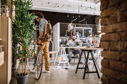 Modern office with a man and his bike