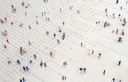 People walking on a square with number on the floor