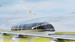 Hyperloop train in green landscape