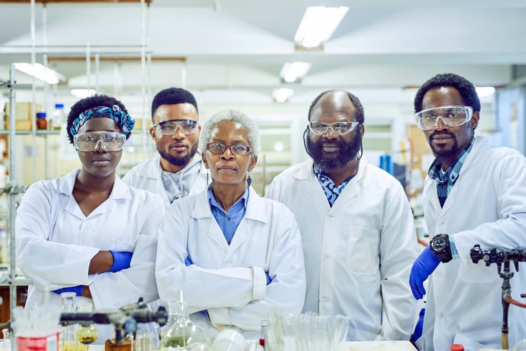 Group of pharma scientists working together in a lab