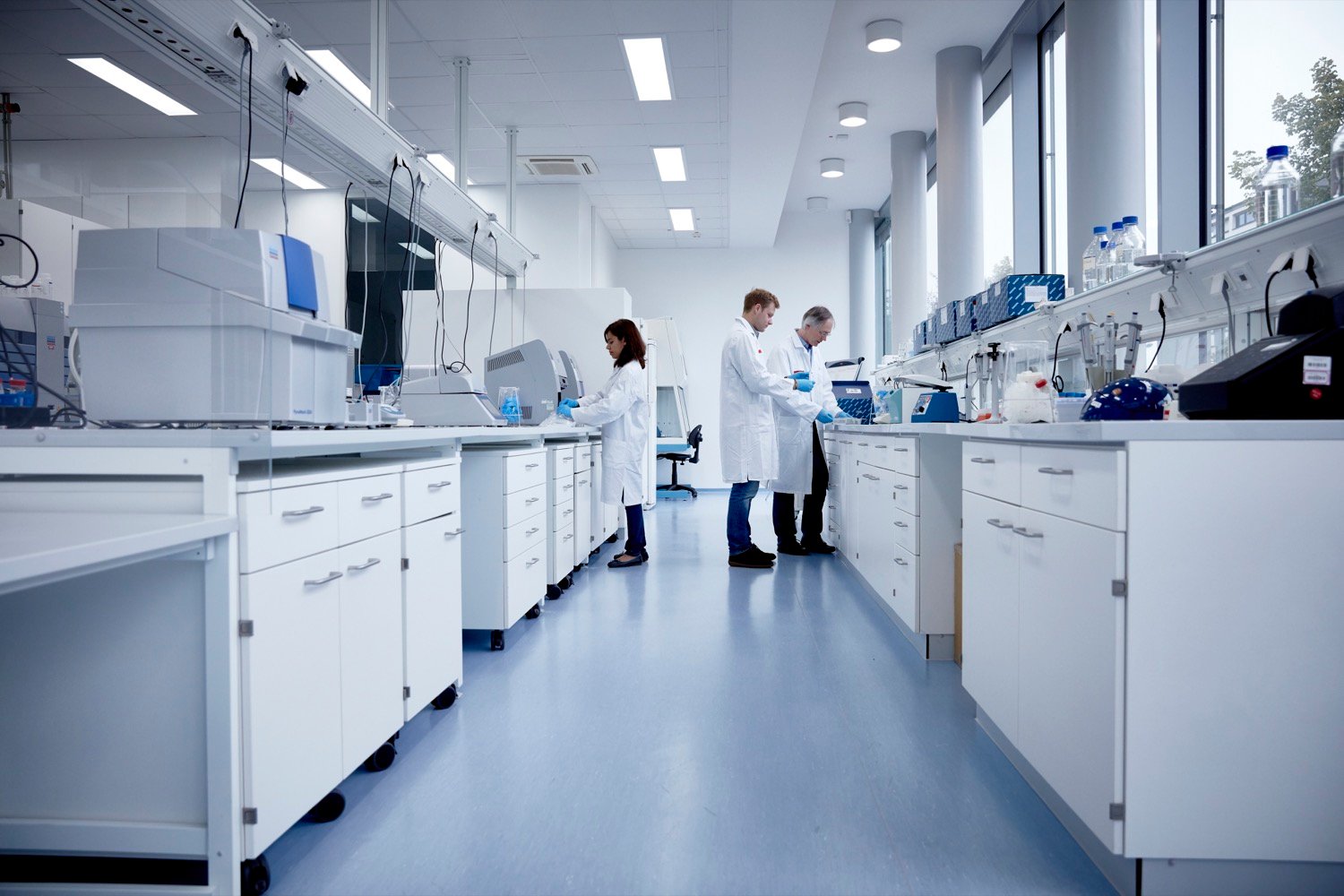 Scientists working in a pharmaceutical research lab, representing environments where medical science liaisons support clinical education.
