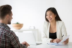 Two professionals sitting in an interview for a manager position