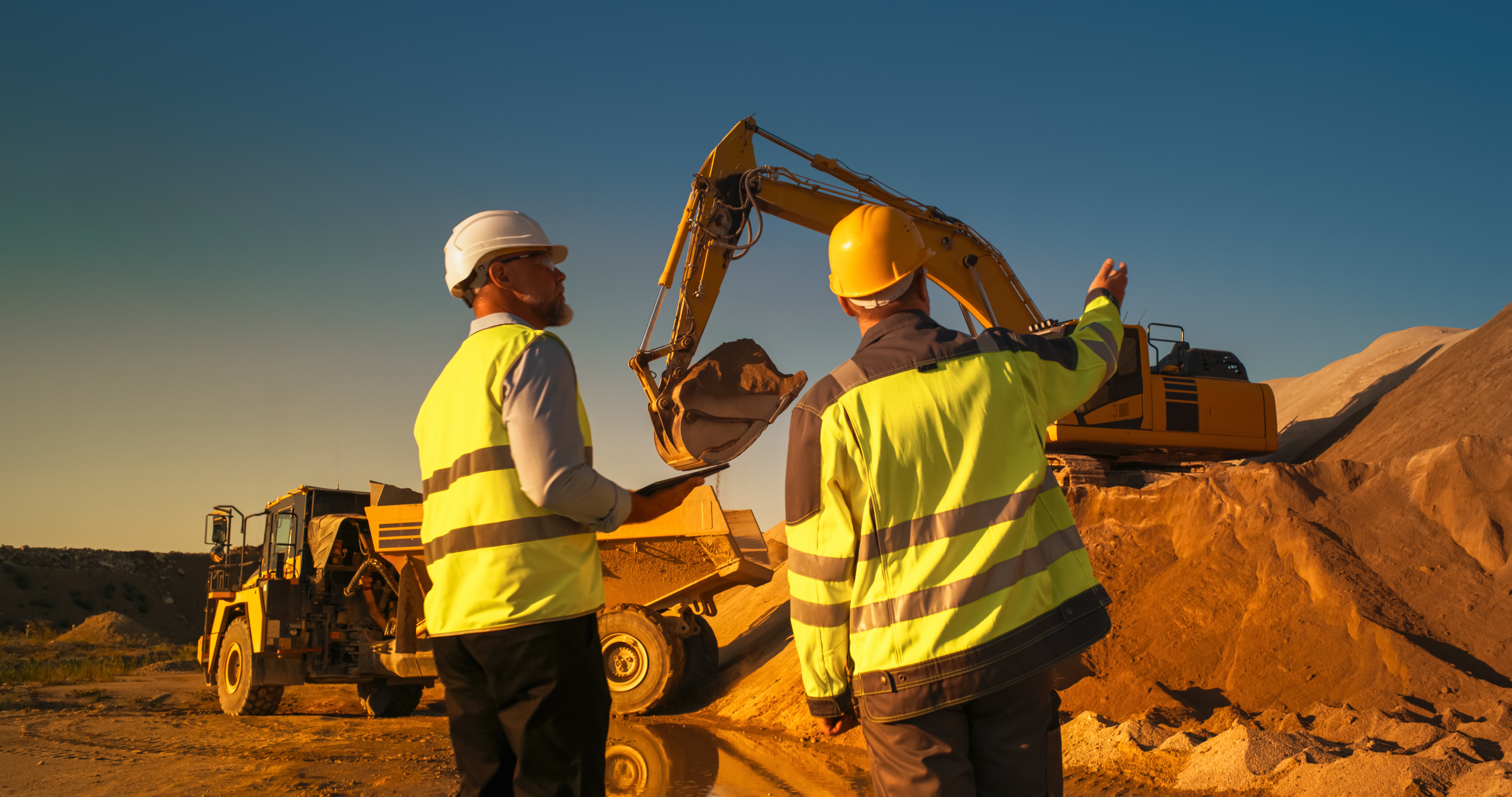 Field service technician inspecting industrial equipment at a client site.