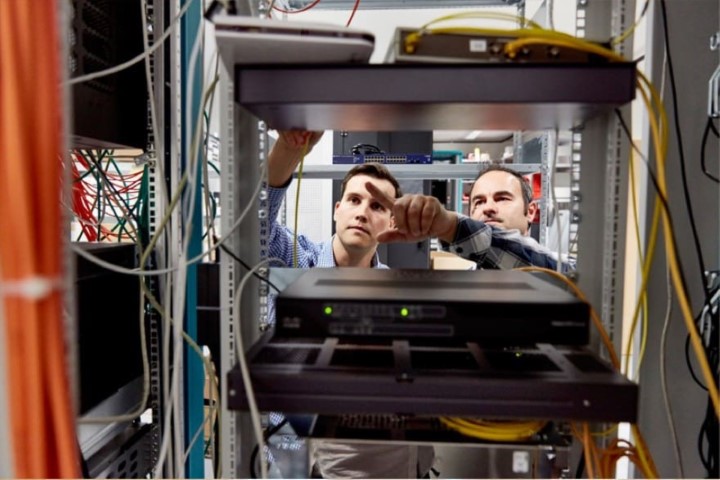 Data center technicians performing server maintenance as part of outsourced workforce solutions