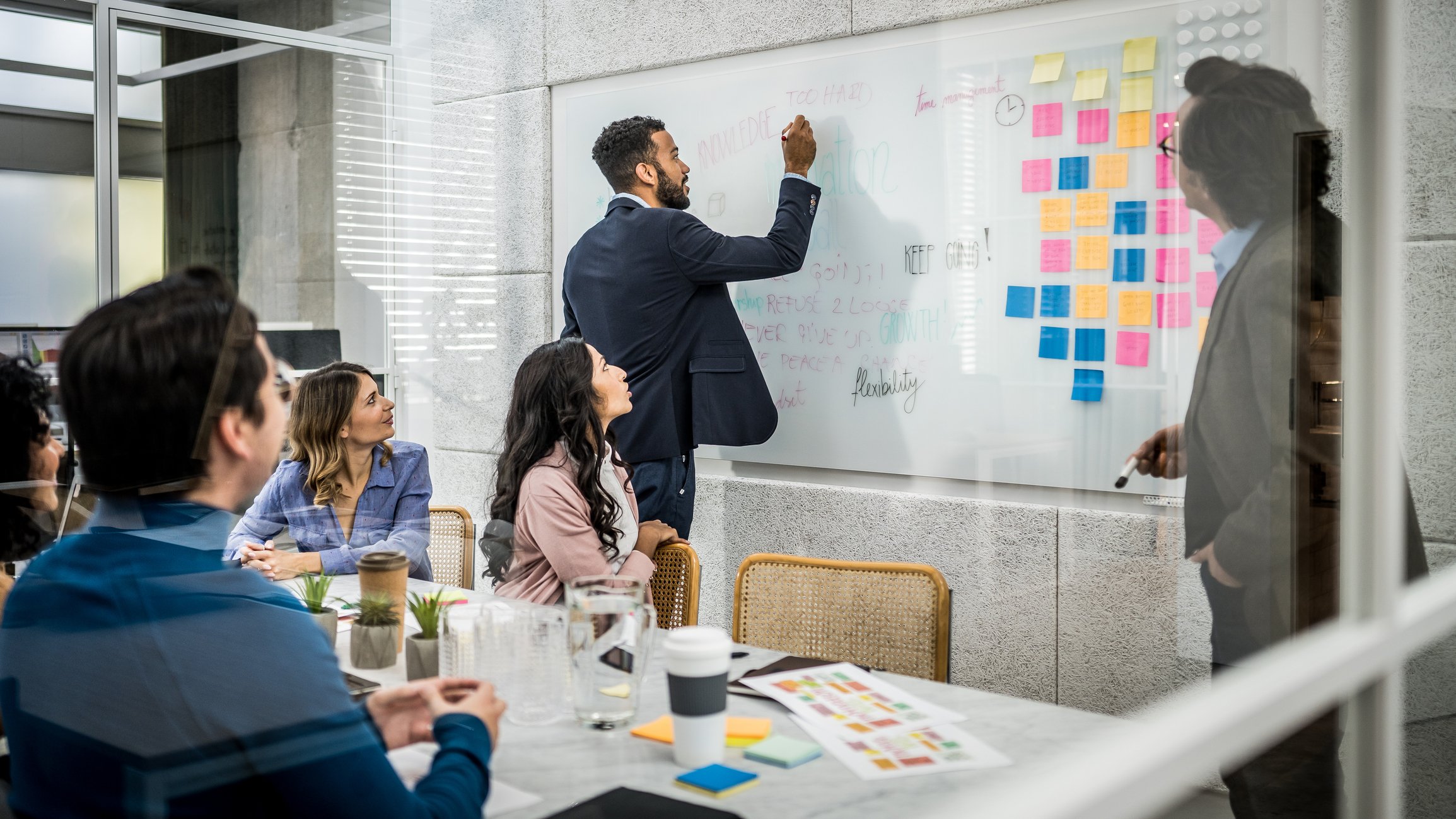 A project manager directs a meeting in a board room. Brunel's project manager career guide is created to help you grow in your career. Learn more.