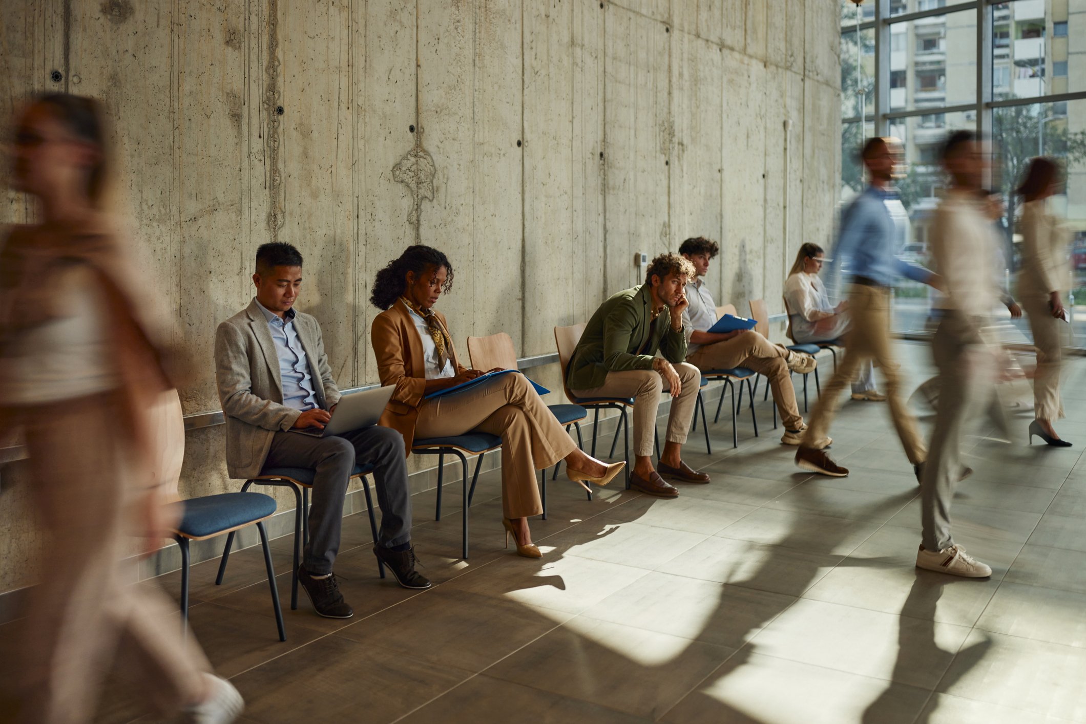 Candidates line up for an interview. Hiring challenges in the energy industry have made many organizations turn to oil and gas recruitment as a solution to common hurdles.