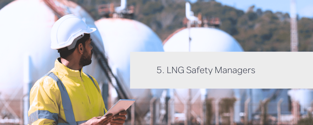 LNG Safety Manager looks out on LNG terminal while assessing safety protocols on a tablet