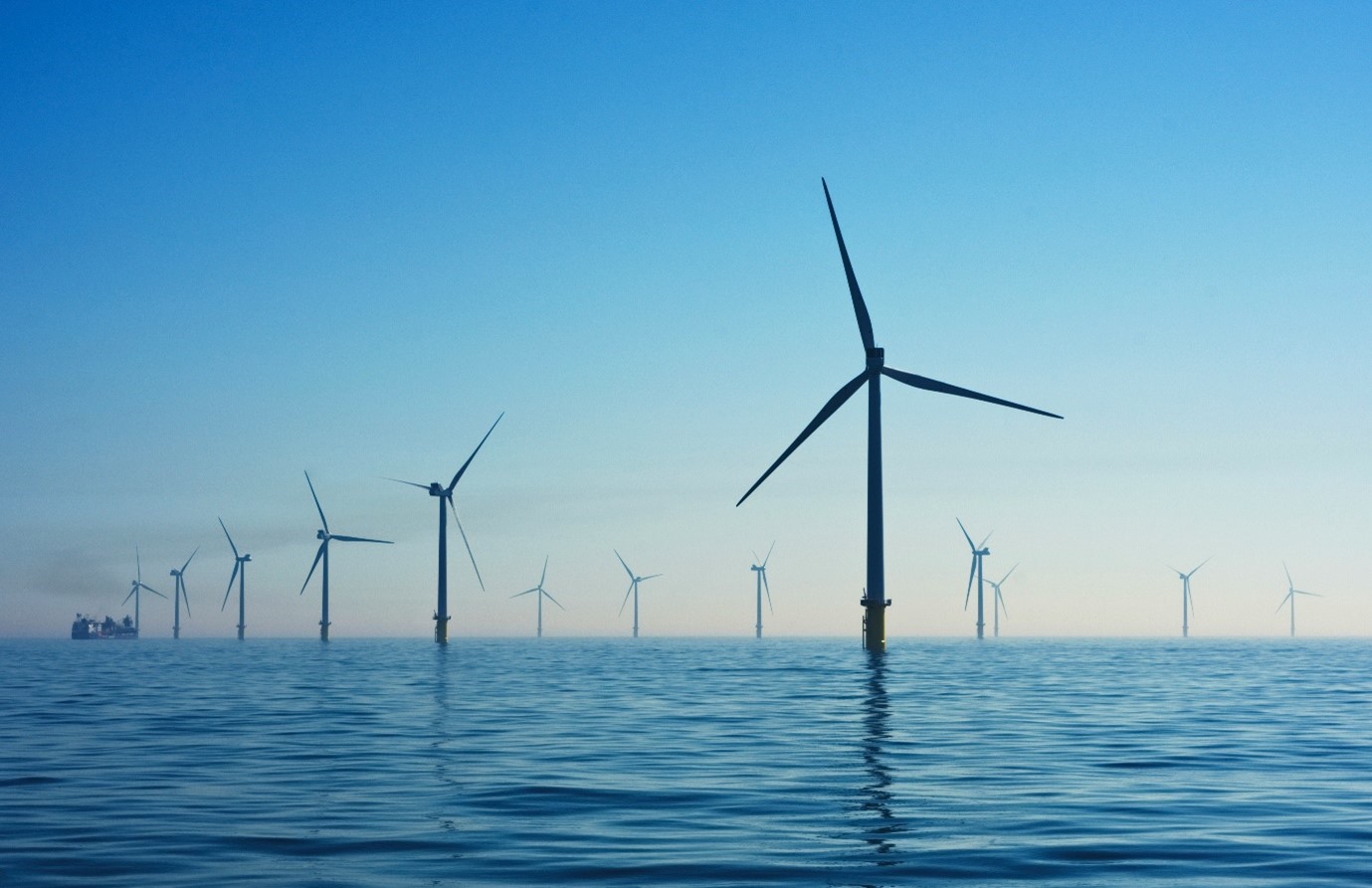 A group of wind turbines in the ocean