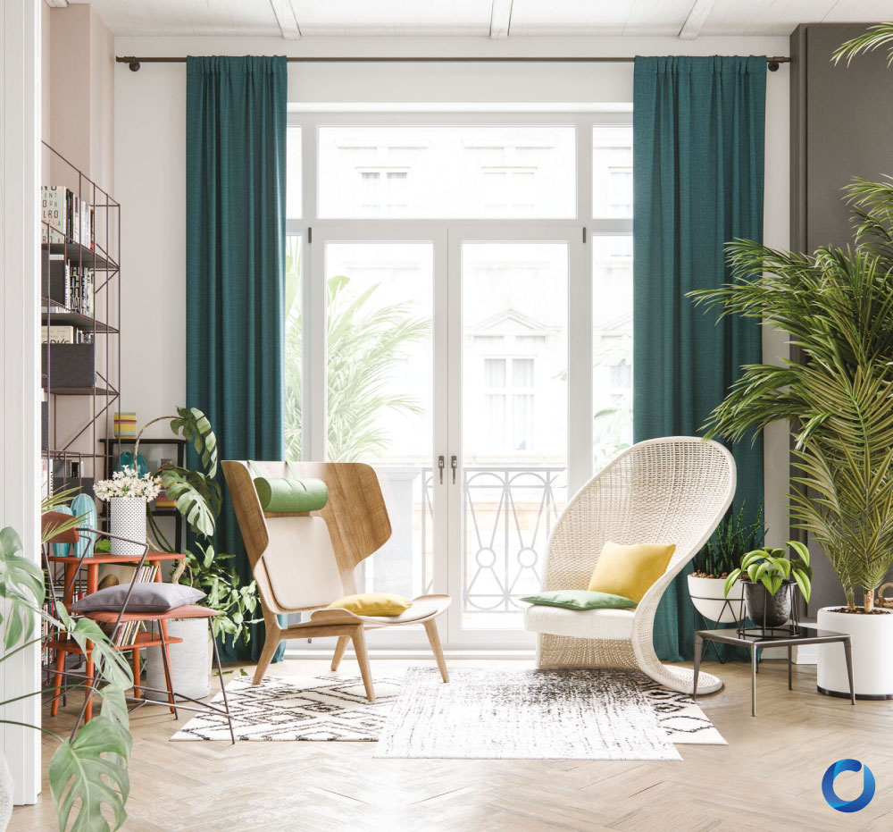 Bright, eclectic living space featuring teal floor-length curtains, a mix of modern and rattan chairs, wooden flooring, and potted plants. The room includes bookshelves, colorful accents, and natural light for a cozy, vibrant ambiance.
