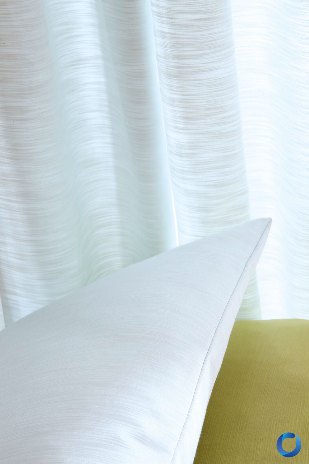 Close-up of soft textured fabric curtains and cushions. Raider Collection