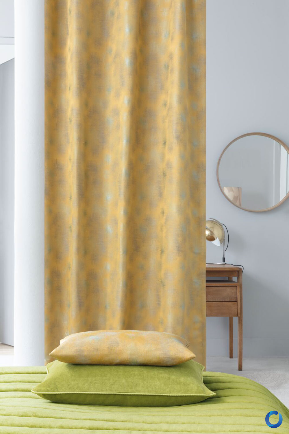 Yellow patterned curtain in modern bedroom with green bedding. Jubilea Collection