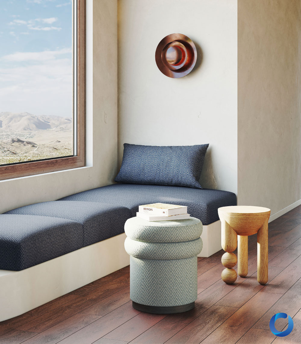 Cozy window seat with textured blue upholstery and wood accents. Synergy Collection