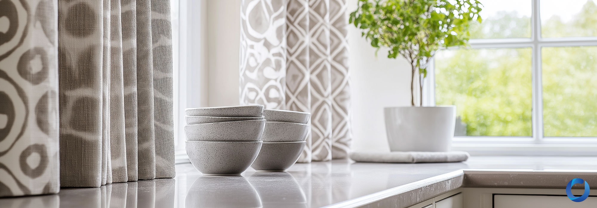 Close-up of patterned kitchen curtains with neutral tones and soft textures.